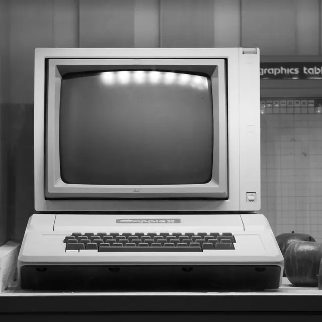 Black and white image of a classic Apple II computer on display in Wrocław, Poland.